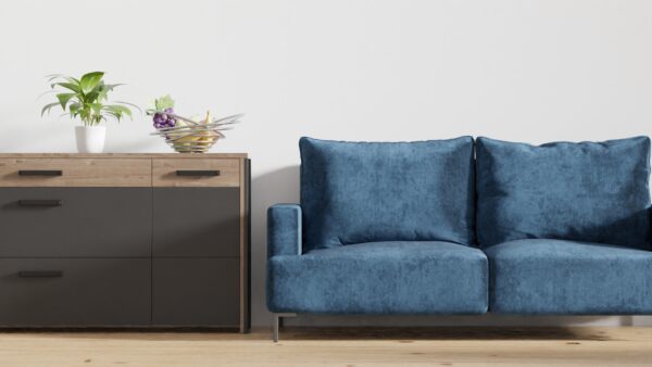 Stylish minimalist living room featuring a blue sofa and wooden cabinet.